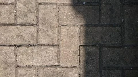Gray Paving Block with Harsh Shadow Stock Photos