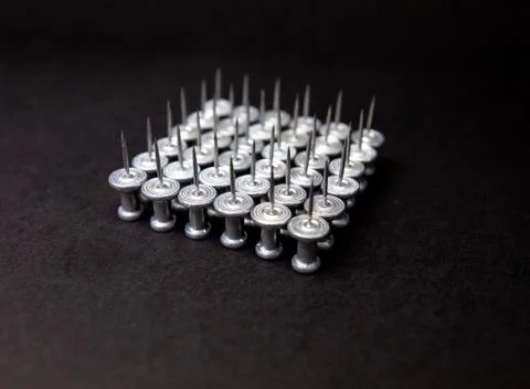 Gray pins close up on black isolate background Stock Photos