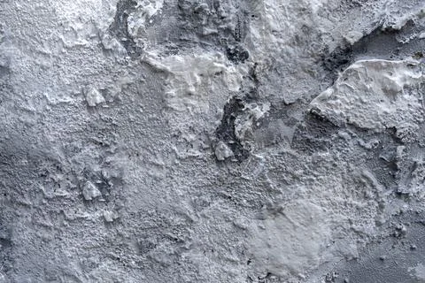 Gray plaster texture with silver and white spots. Cement wall background. Stock Photos