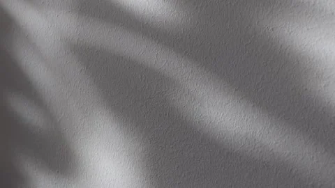 Gray plaster wall texture with sunlight spots and shadows Stock Footage 330659889