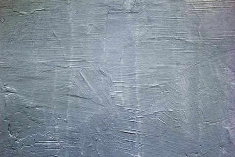 Gray plastered wall. Gray background. The texture of an old painted wall. Stock Photos
