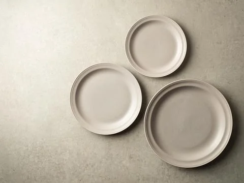 Gray plate by size Stock Photos