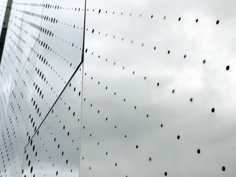 Gray plate surface with small holes Foto stock