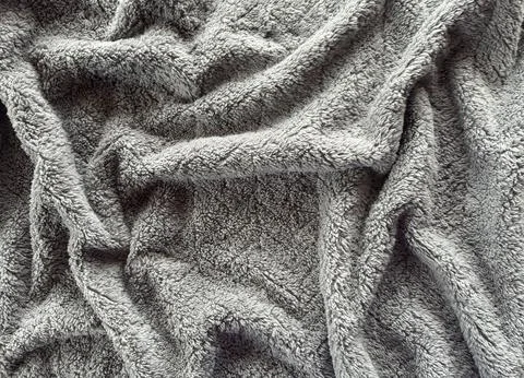 Gray Plush Fabric Texture with Soft Folds 스톡 사진