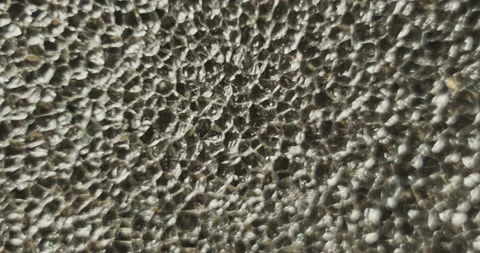 Gray porous surface. Abstraction, close-up, macro Vídeo Stock 229547523