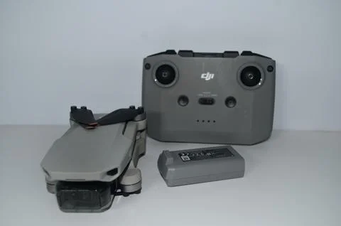 Gray Quadcopter DJI Mini 2 with remote control isolated on white background Stock Photos