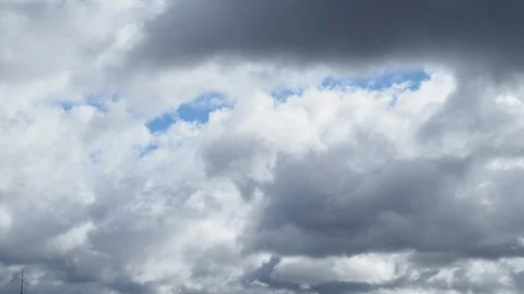 Gray rain clouds cover blue sky in autumn Stock Footage 95853519