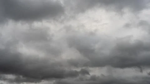Gray rain clouds. Weather before the rain. Waiting for the storm and thunder. Stock Photos