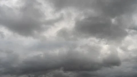 Gray rain clouds. Weather before the rain. Waiting for the storm and thunder. Stock Photos