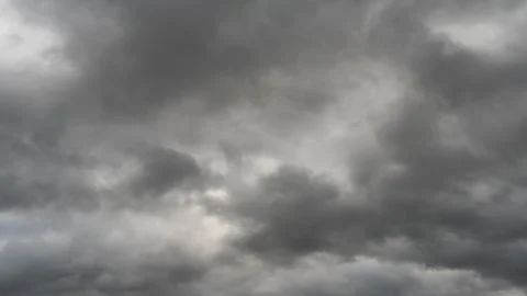 Gray rain clouds. Weather before the rain. Waiting for the storm and thunder. Stock Photos