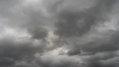 Gray rain clouds. Weather before the rain. Waiting for the storm and thunder. Stock Photos