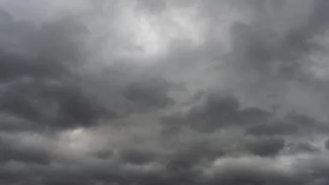 Gray rain clouds. Weather before the rain. Waiting for the storm and thunder. Stock Photos