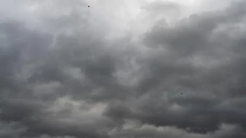 Gray rain clouds. Weather before the rain. Waiting for the storm and thunder. Stock Photos