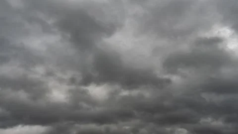 Gray rain clouds. Weather before the rain. Waiting for the storm and thunder. Stock Photos