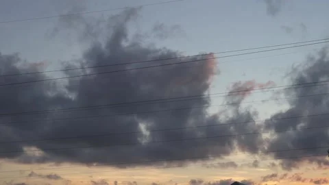 Gray rain cloudy sky with clouds floating fast on warm summer evening sunset Stockbeeldmateriaal 163185521