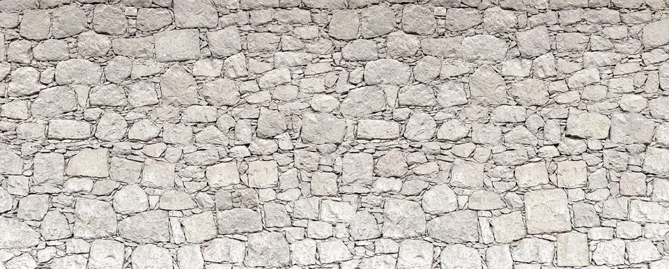 Gray random rubble stone wall pattern texture Stockfoto's