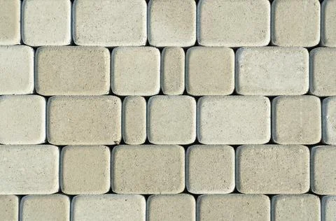 Gray rectangular paving slabs with rounded edges. Top view Stock Photos