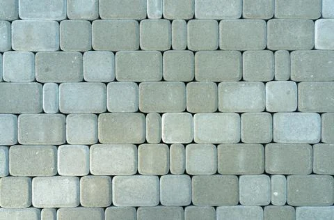 Gray rectangular paving slabs with rounded edges Stock Photos