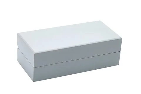 A gray rectangular wooden gift box for jewelry storage. Stock Photos