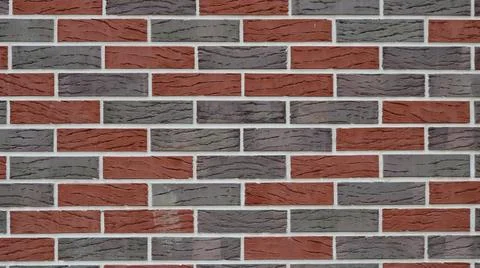 Gray-red brick wall as background Stock Photos