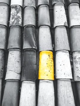 Gray rooftop with yellow tile Stock Photos