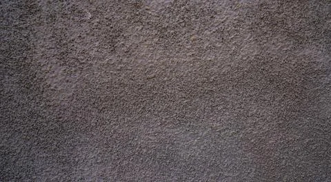 Gray rough plaster wall texture with rustic stucco surface Stock Photos