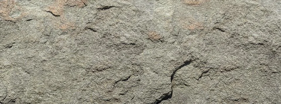 Gray rough rock surface creating natural background Stock Photos