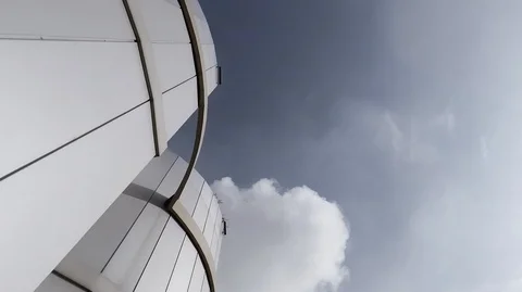 Gray rounded facade of plastic panels against the blue sky Stock Footage 125069002