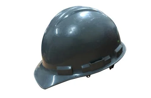 Gray safety helmet on the table in the construction office Stock Photos