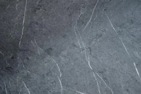 Gray scratched stone texture on background. Texture wallpaper Stock Photos