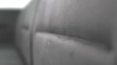 Gray side of the modern sofa is made of suede velvet fabric Видео 219583136