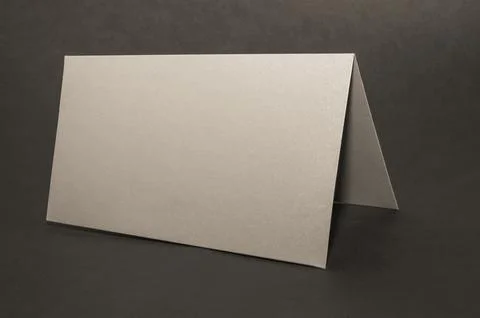 Gray, silver envelope on a black flat background, luxury corporate identity a Stock Photos