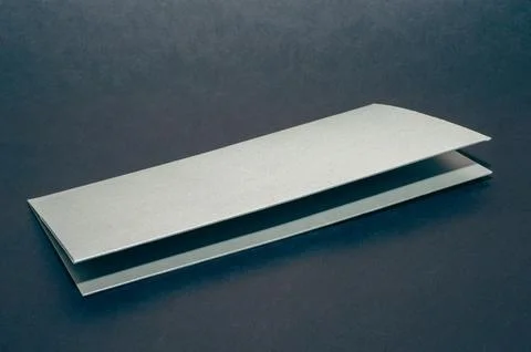 Gray, silver envelope on a black flat background, luxury corporate identity a Stock Photos