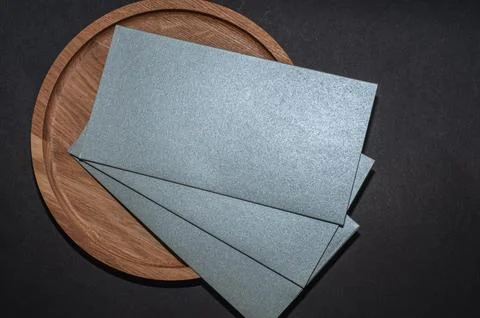 Gray, silver envelope on a wood flat background, luxury corporate identity .. 写真素材