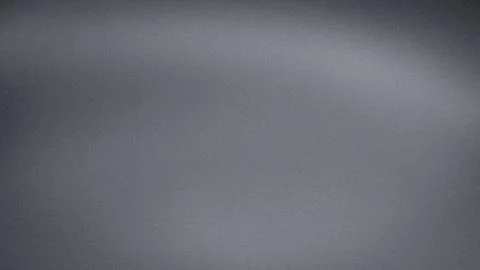 Gray silver grainy abstract background with smooth gradient blur texture in.. Stock Photos