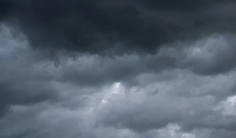 Gray sky with black clouds Stock Photos