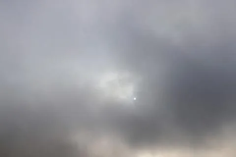 Gray sky covered with thick clouds and thick fog that slowly dissipates from  Stock Photos