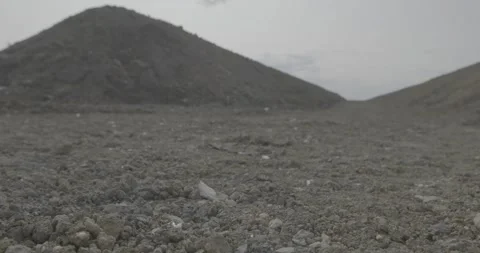 Gray sky, two piles, two mountains of rock mixture Stock Footage 305641939