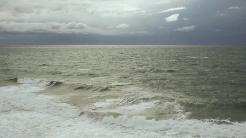 Gray sky with white clouds and post-storm sea Stock Footage 82022605
