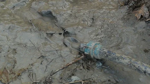 Gray sludge comes out of the pipe under high pressure Stock-Footage 122323182