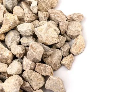 Gray small rocks ground texture isolated on white background. Small road ston Stock-Fotos