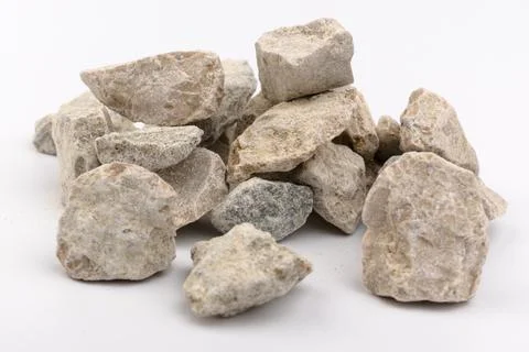 Gray small rocks ground texture isolated on white background. Small road ston Photos