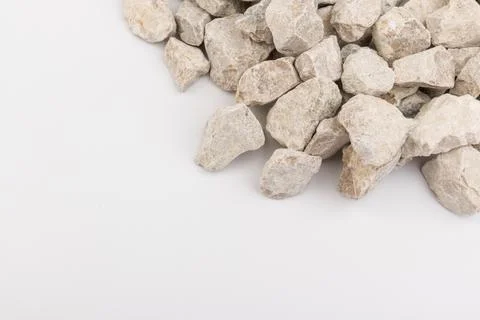 Gray small rocks ground texture isolated on white background. Small road ston Stock-Fotos