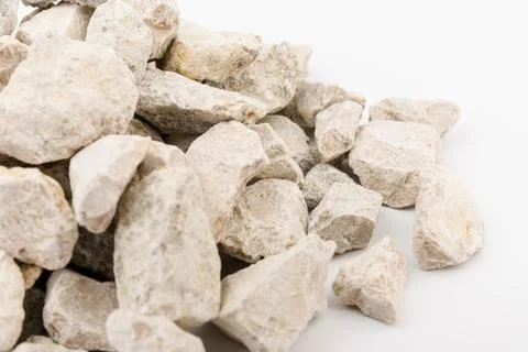 Gray small rocks ground texture isolated on white background. Small road ston Stock-Fotos