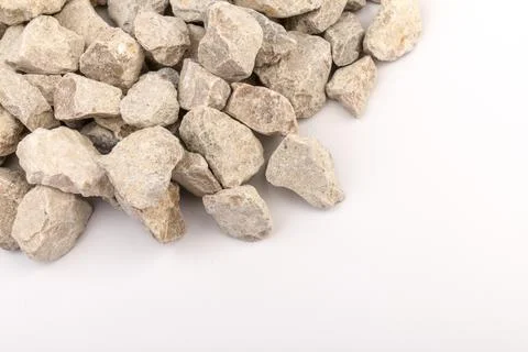 Gray small rocks ground texture isolated on white background. Small road ston Stock-Fotos