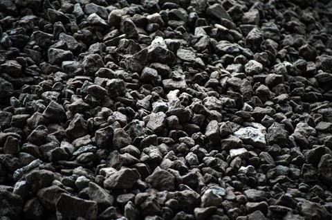 Gray small rocks ground texture. black small road stone background. gravel pe Stock Photos