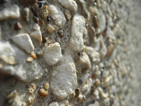 Gray small rocks ground texture. Gravel pebbles stone seamless texture. Backg Stock Photos