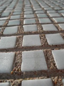 Gray small rocks ground texture. Gravel pebbles stone seamless texture. Backg Stock Photos