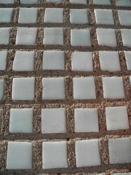 Gray small rocks ground texture. Gravel pebbles stone seamless texture. Backg Stock Photos