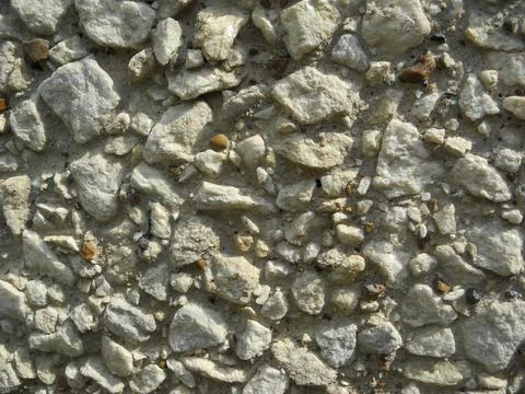 Gray small rocks ground texture. Gravel pebbles stone seamless texture. Backg Stock Photos